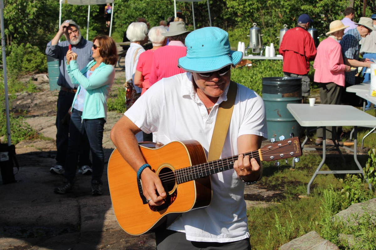 Doug Healy of Healy and Orr entertains on the banks of the St. Lawrence River