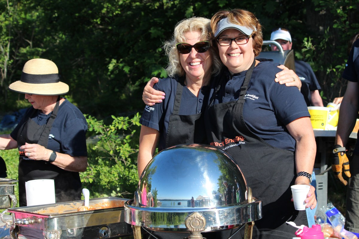 volunteers serving during Island Breakfast