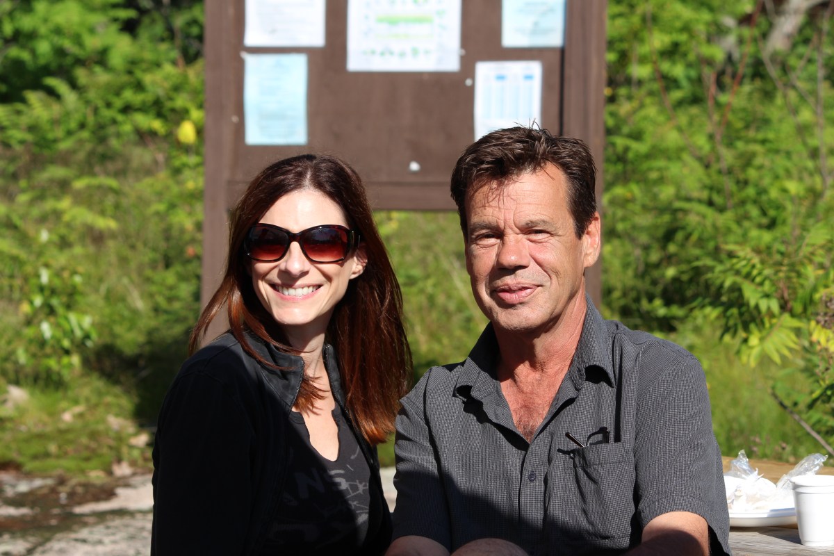 Under the Refugee Island sign